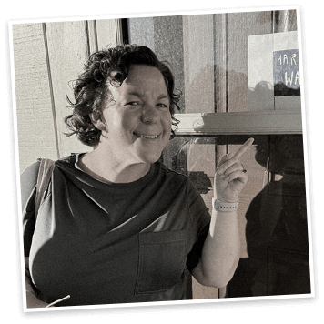 Jackie Williamson pointing to an image on a shelf